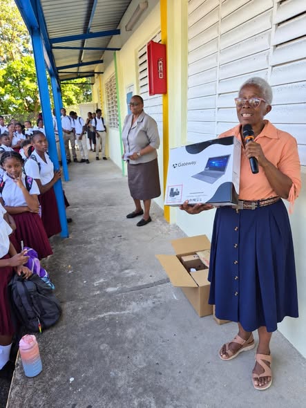 Member of the Diaspora Gifts Laptops and Electronic Items to MSS Students
