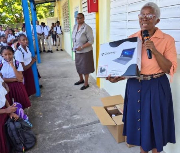 Member of the Diaspora Gifts Laptops and Electronic Items to MSS Students